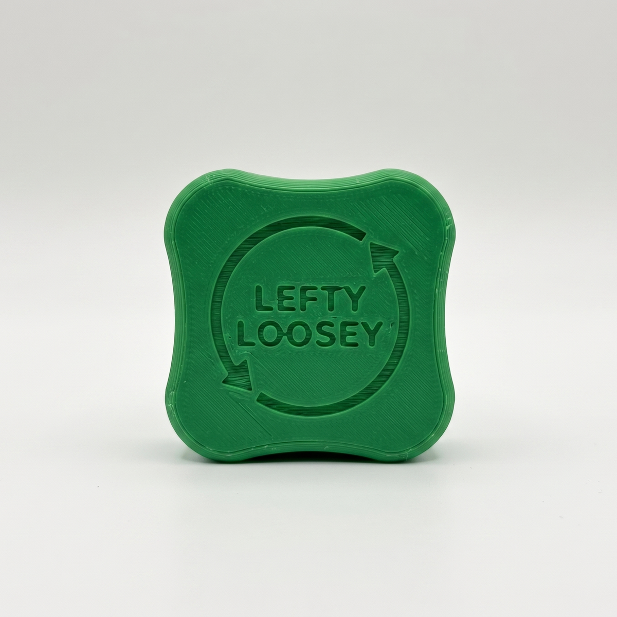 A green, square-shaped plastic container with rounded corners and embossed branding that reads 'LEFTY LOOSEY' inside a circular arrow, set against a plain light gray background.