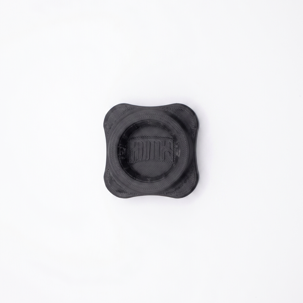 A black 3d printed 4 lobed bottle opener
