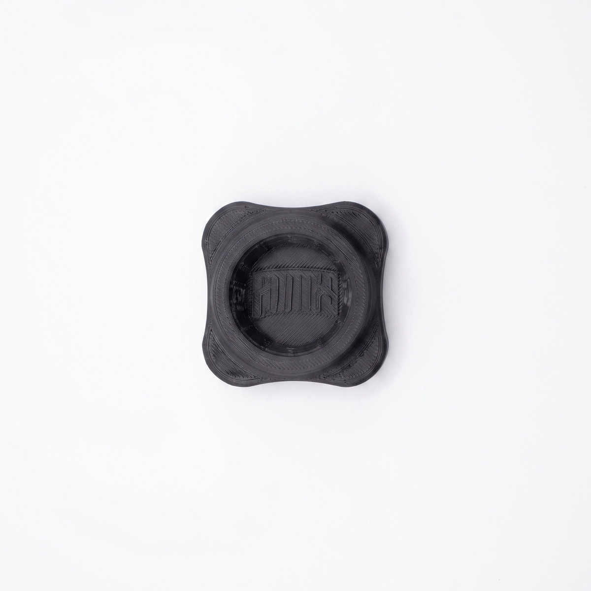 A black 3d printed 4 lobed bottle opener