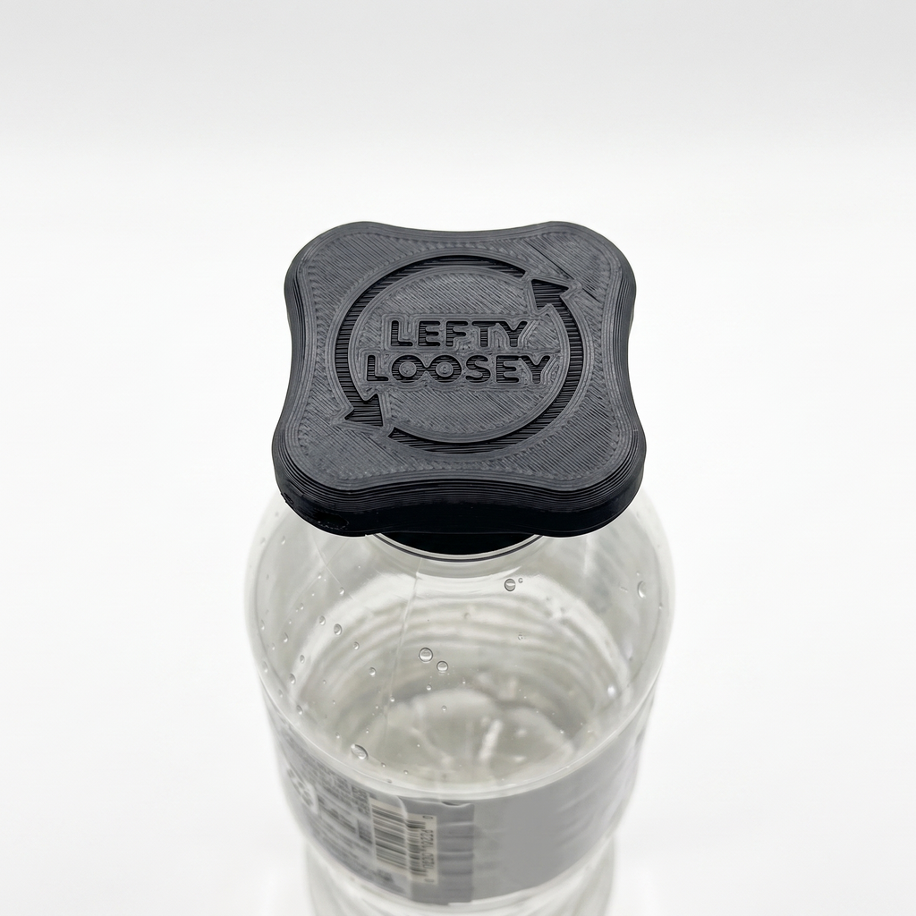 A clear plastic water bottle with a black square cap featuring the embossed text 'LEFTY LOOSEY' and circular arrows, shown on a white background.