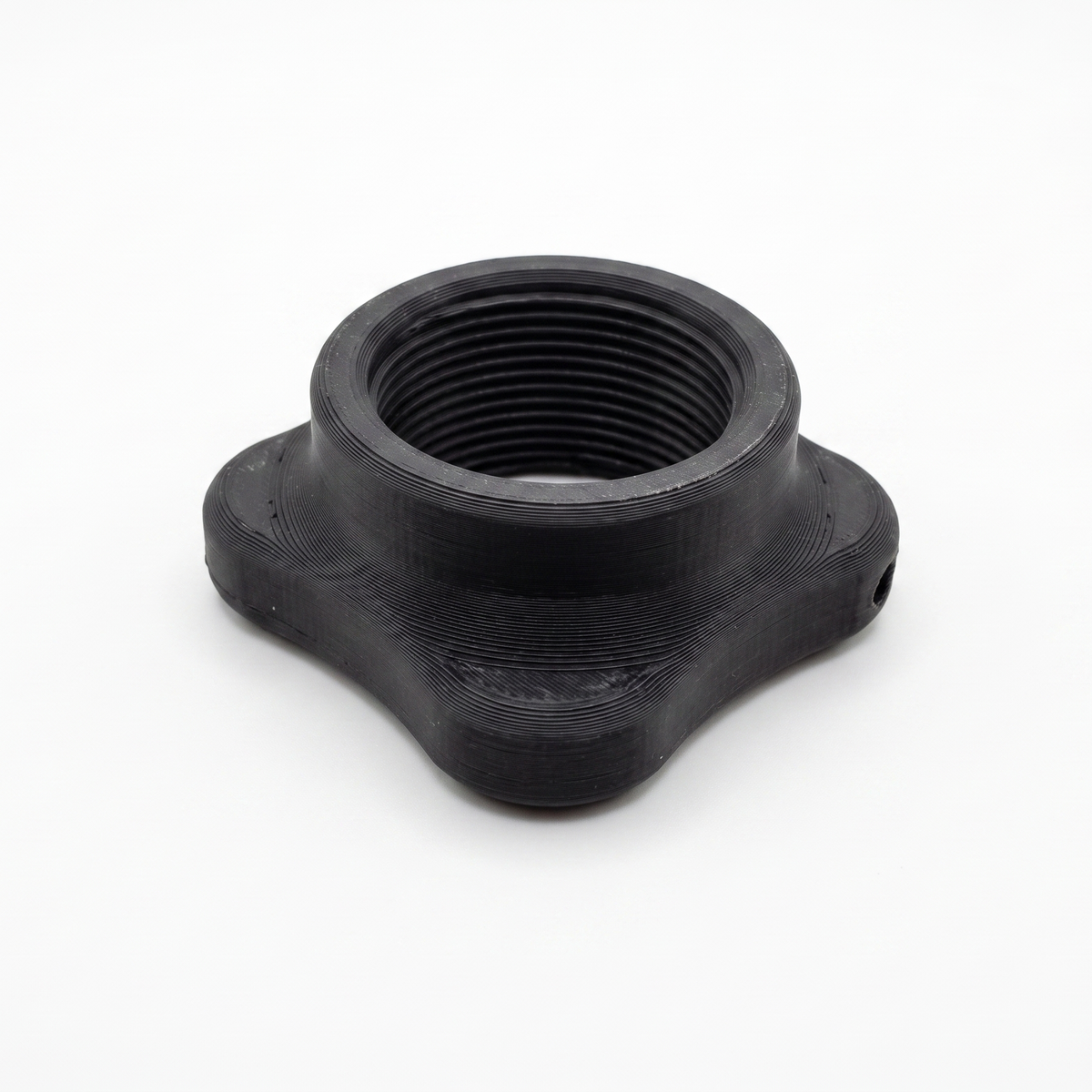 A black plastic threaded adapter or coupler with a four-pointed star-like base, shown on a plain white background.
