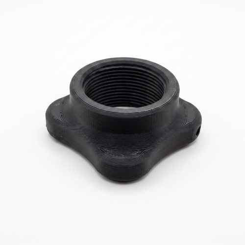 A black plastic threaded adapter or coupler with a four-pointed star-like base, shown on a plain white background.